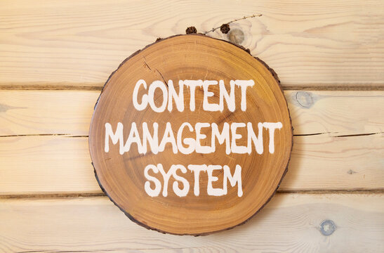 Content management system symbol. Concept words Content management system on beautiful wooden circle. Beautiful wooden wall background. Business content management system concept. Copy space.