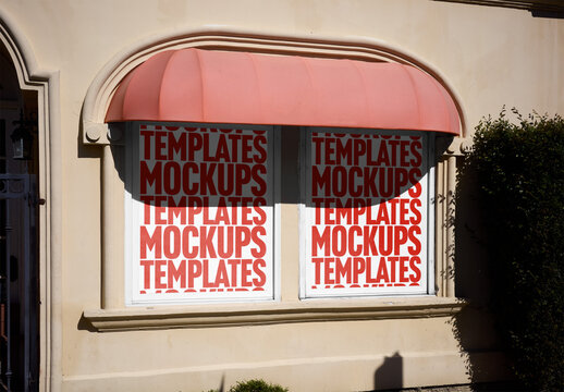 Mockup Of Two Customizable Posters In Shop Window Under Awning