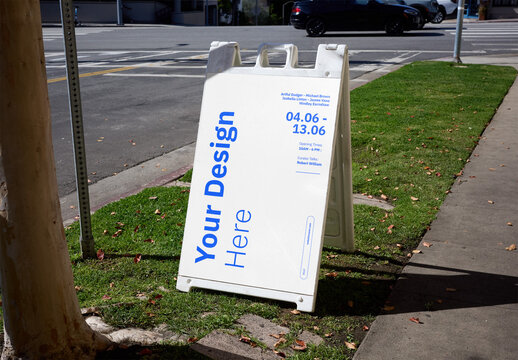 Mockup Of Customizable A-Frame Sidewalk Sign On Grass Verge