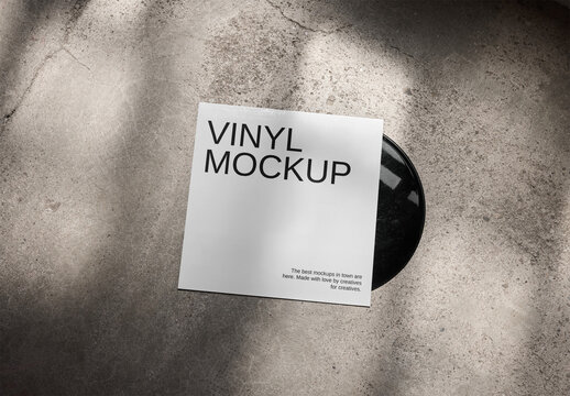 Mockup Of Customizable Album Cover With Vinyl Disc On Concrete Floor