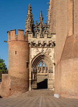Albi, France &mdash; Portico of the magnificent Sainte-C&eacute;cile Cathedral, built of red brick, on the Tarn River in Albi, Occitanie (Southwestern France)