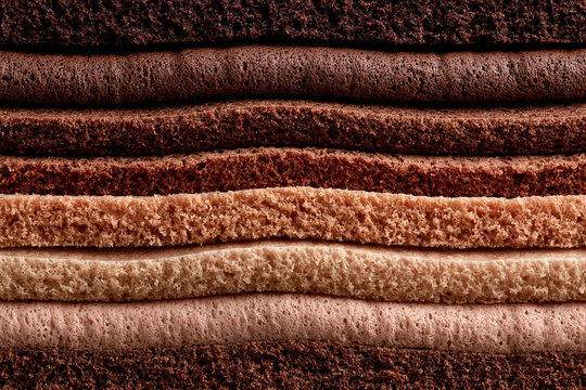 Layers of soft brown and beige textured fabric stacked in horizontal parallel lines