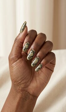 Snake Print Nails on Dark Skin, Close-Up of Hand with Long Manicure for Beauty and Fashion