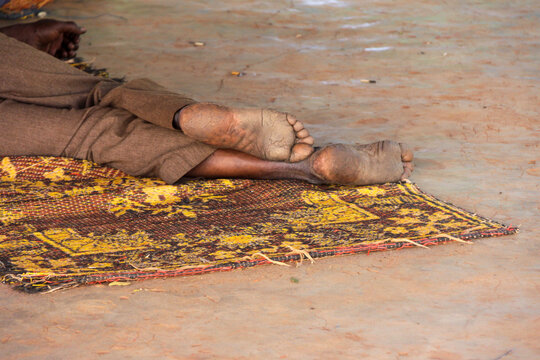 Feet of a Muslim sleeping on a mat in the mosque, Hauts-Bassins Region, Bobo Dioulasso, Burkina Faso