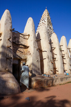 Man in white robe entering the Grand Mosque through a side door, Hauts-Bassins Region, Bobo Dioulasso, Burkina Faso
