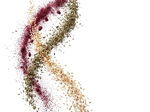 Floating Sumac Powder, Dried Thyme, and Toasted Sesame Seeds on White Background