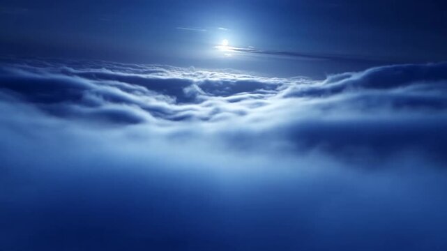 Glowing moon above rolling night clouds in deep blue sky, still cloud sea below