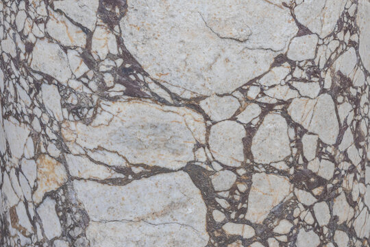 The polished surface of a granite column in the ancient city of Perge. Columns of ancient Perge. Ancient structures. Granite background. Excavations in an ancient antique city.