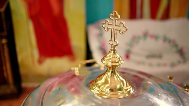 Orthodox Christian baptism of a baby in a church, featuring sacred icons, crosses, candles, and religious rituals symbolizing faith, spiritual blessings, and family traditions.