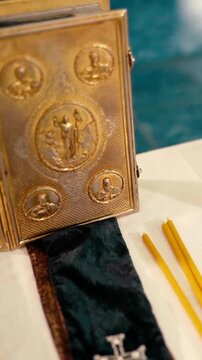 Orthodox Christian baptism of a baby in a church, featuring sacred icons, crosses, candles, and religious rituals symbolizing faith, spiritual blessings, and family traditions.