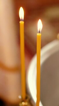 Orthodox Christian baptism of a baby in a church, featuring sacred icons, crosses, candles, and religious rituals symbolizing faith, spiritual blessings, and family traditions.