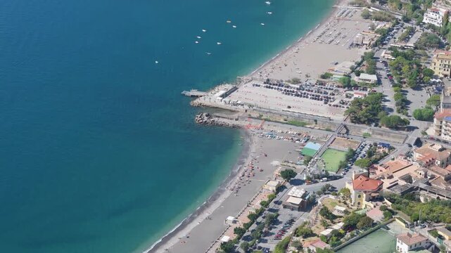 Aerial view of Marina di Vietri beach rising to green mountains