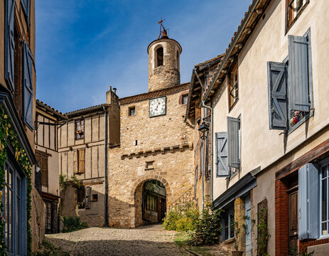 Cordes-sur-Ciel, France - The Porte de l&rsquo;Horloge (Clock Gate) is a historic mediaeval fortified gate in Cordes-sur-Ciel, a hilltop bastide town in the Tarn department of southern France.