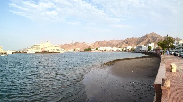 Muttrah Corniche in Muscat, Oman, featuring waterfront views, traditional architecture, harbor scenery, and coastal mountains. Muscat, Oman - &lrm;August &lrm;3, &lrm;2026