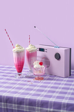 Pink milkshakes and ice cream with retro style radio