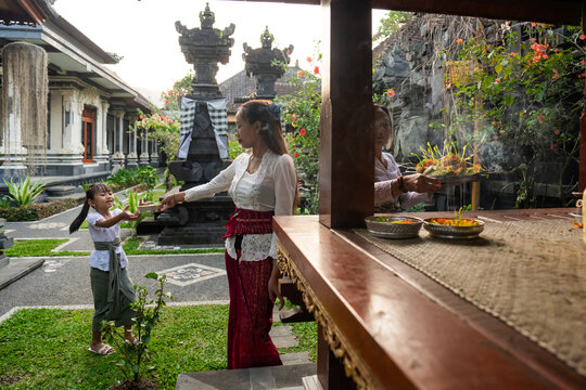 Balinese Family Celebrates Tradition in Their Garden