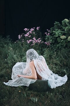 Portrait of anonymous woman sit in bath