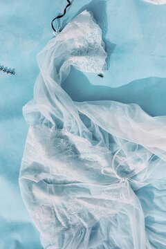 Transparent White Dress Detail on Pastel Background