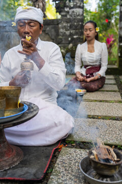 Ceremony in Bali With Smoke and Offerings