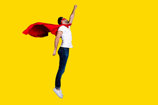Full length body size profile side view of his he nice-looking attractive content strong powerful sportive macho bearded guy rising hand up flying isolated over gray pastel background