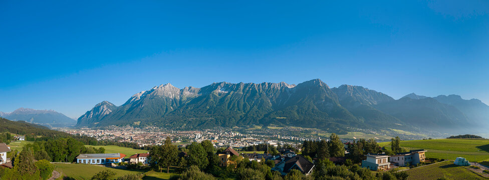 Panoramic view of Innsbruck city nestled in Inntal valley with Karwendel Nordkette mountain range Tyrol Austria