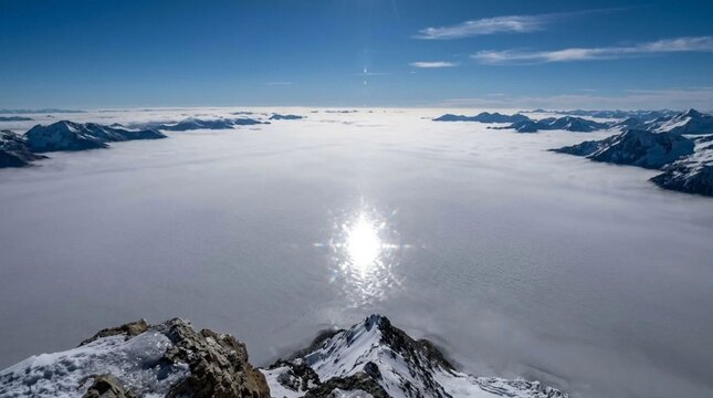Cloud Ocean and Sun Glitter from Mountain Summit Description
