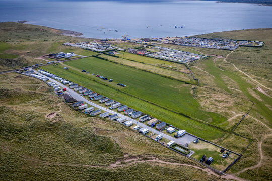Aerial view of caravan park and camping site on the Maharees peninsula in Kerry Ireland. Holiday caravan parks and camping sites located on Maharees peninsula near Castlegregory on Dingle Peninsula. 