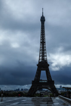 Eiffel Tower against dramatic stormy sky
