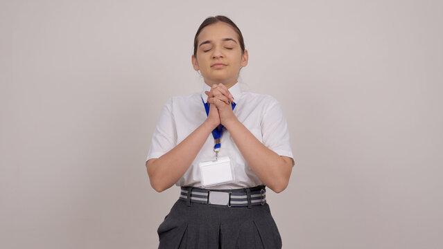 Indian Schoolgirl Praying with Folded Hands