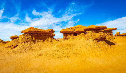 Mushroom shaped sandstone hoodoos in Goblin Valley desert © PhotoSpirit