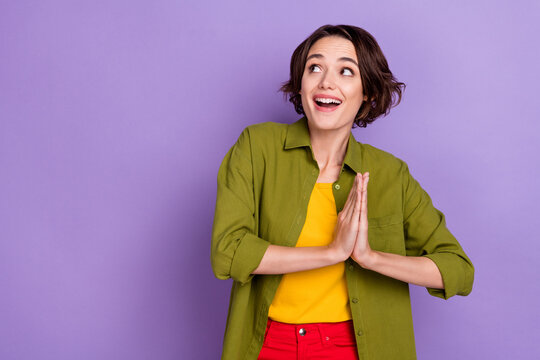 Photo of young excited girl amazed look empty space make wish expect isolated over violet color background