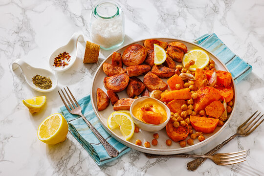 Baked sausage slices with veggies and chickpeas