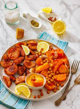 Baked sausage slices with veggies and chickpeas