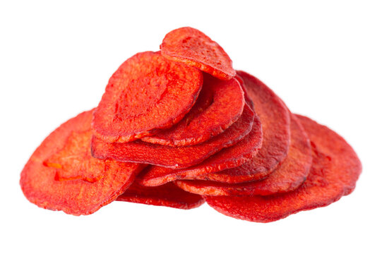 Crispy roasted carrot chips with sea salt, isolated on white background. Healthy and crunchy natural vegetable snack. Clipping path.