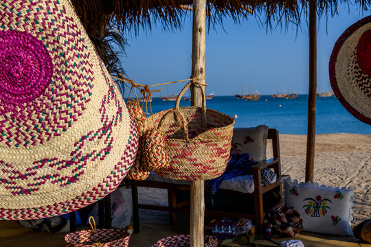 Doha, Qatar &ndash; November 29, 2023: Handicrafts and handmade items crafted from palm fronds, "Khous," decorate artisans' booths on Katara beach during the 13th Traditional Dhow Festival.