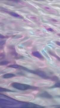 Iridescent liquid metal surface creating smooth chromatic waves in gentle motion for dynamic futuristic backgrounds