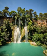Sillans waterfall flowing into a turquoise pool © Johann