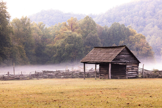 Old Log Barn Farm Building With Fence at Oconaluftee Visitor Center in Great Smoky Mountains National Park