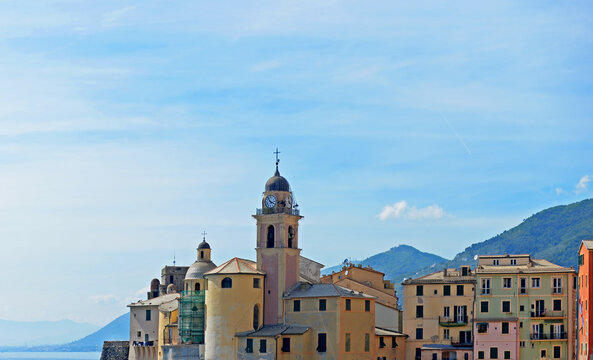 View on the beautiful picturesque village of Camogli on the Ligurian coast or Italian Riviera with mountains in the back near Genova, Italy
