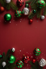 Ornament frames vertical burgundy red copy space with pine branches for Christmas greetings © ActionGP