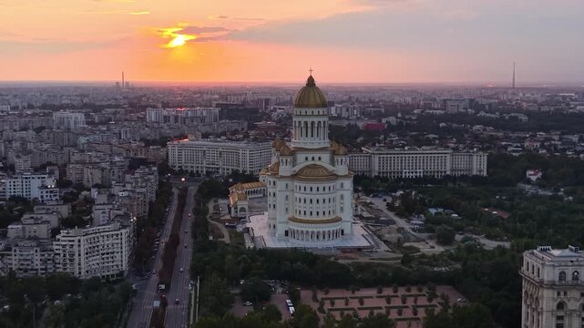 Aerial of People's Salvation Cathedral and sunset skyline in Bucharest, Romania