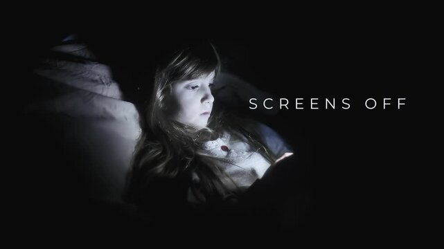 Girl lying in bed at night lit by smartphone glow yawns and drifts to sleep. Screens off, dreams on text overlay promotes digital wellness, healthy habits and screen time balance for children.