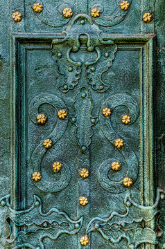 Ancient metal texture with gold studs.
