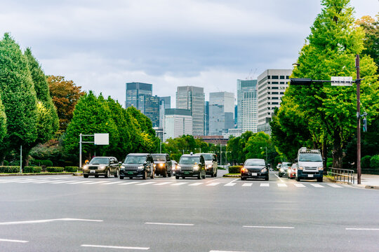 Taxi cars ride in the streets of Tokyo, Japan.