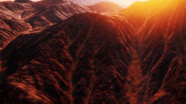 Dramatic mountain landscapes stretch into the horizon, illuminated by the warm, golden rays of the rising sun. Shadows and light dance across the rugged terrain, creating an enchanting scene.