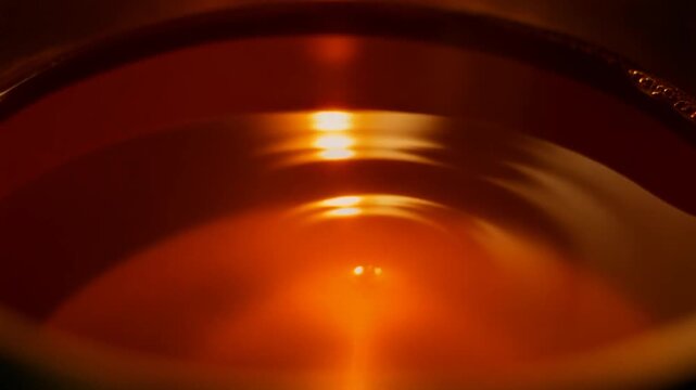 Solder bath shimmering in a workshop