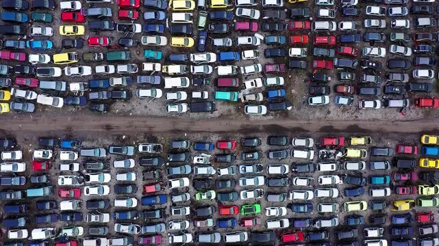 Aerial view of car scrap yard showing rows of abandoned vehicles for disassembly in Burgas, Bulgaria