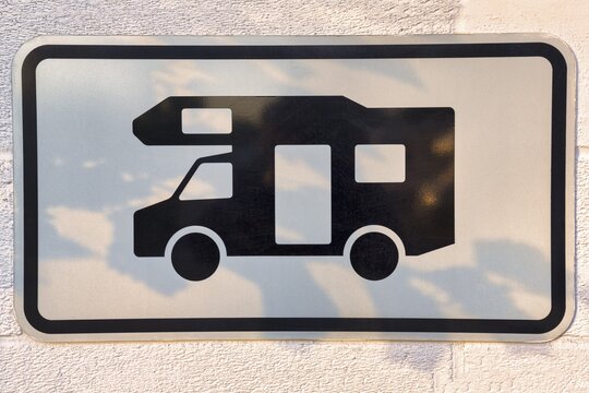 Sign with pictogram camper van on a wall, camper van pitch, Schleswig-Holstein, Germany