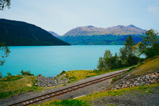 Alaska Railroad Tracks  and road along the Turquoise Shore of Kenai Lake on the Way to Seward, Alaska. the scenic Anchorage to Seward rail route through the Chugach National Forest