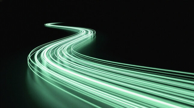 Green light trails flow dynamically on a dark reflective surface